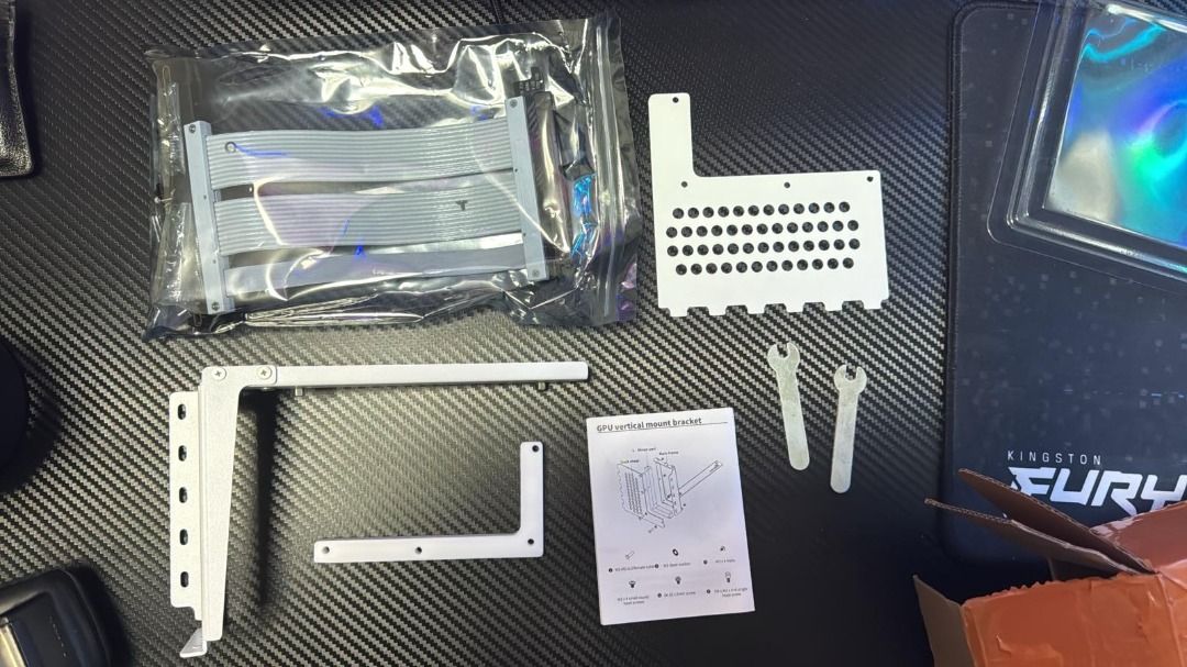 GPU Vertical Mount Kit (Category: Computer Parts) located in Singapore. Submitted by _nitsujjj (Listing ID 1398287582, Image 1). Description: - GPU vertical mount kit - Includes bracket, riser cable, and screws.