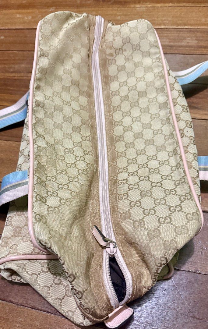 Gucci GG Canvas duffle Bag (Category: Luxury Bags & Wallets) located in Manila. Submitted by adanielbm (Listing ID 1398214564, Image 3). Description: - Authentic Gucci duffle bag - Iconic GG canvas pattern - Secure zip closure - Spacious interior - Color scheme: Light green, beige, light blue, white, and brown - Made in Italy.