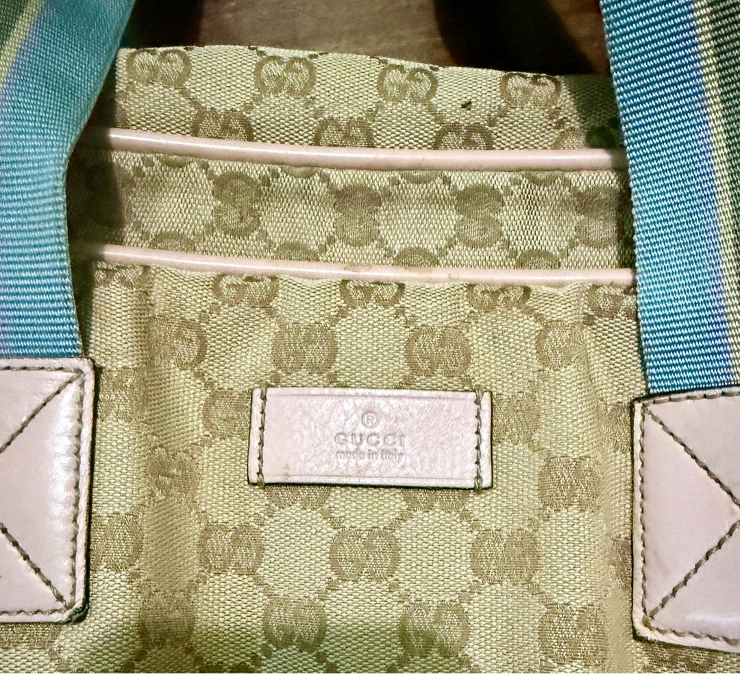 Gucci GG Canvas duffle Bag (Category: Luxury Bags & Wallets) located in Manila. Submitted by adanielbm (Listing ID 1398214564, Image 1). Description: - Authentic Gucci duffle bag - Iconic GG canvas pattern - Secure zip closure - Spacious interior - Color scheme: Light green, beige, light blue, white, and brown - Made in Italy.