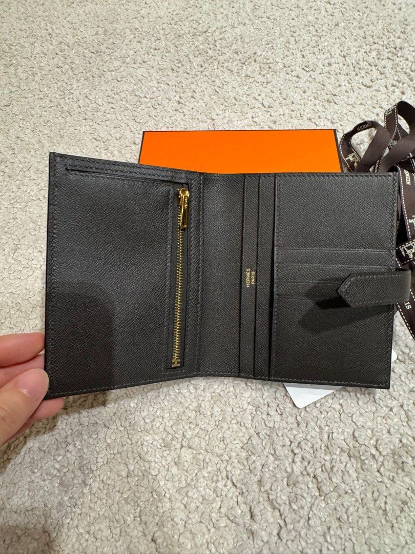 Hermes Bearn Compact Wallet (GHW) 🩶 (Category: Luxury Bags & Wallets) located in Manila. Submitted by hellonixxx (Listing ID 1398313878, Image 2). Description: Color: Graphite (Dark Gray 🩶) / GHW Very nice color 🫶🏻 Compact wallet in Madame calfskin - Leather tab with openwork “H” closure - Zipped change purse - 4 credit card slots - 4 pockets - Bill pocket.