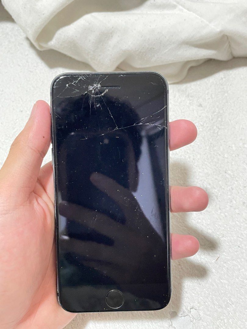 Iphone 8 64gb (Category: iPhone 8 Series) located in Manila. Submitted by cid_barcelona1 (Listing ID 1398218176, Image 2). Description: Defects: crack front and back , cam lens back , home button touch id Other than that working perfectly Newly replaced battery.