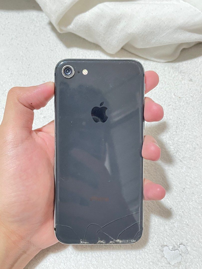 Iphone 8 64gb (Category: iPhone 8 Series) located in Manila. Submitted by cid_barcelona1 (Listing ID 1398218176, Image 3). Description: Defects: crack front and back , cam lens back , home button touch id Other than that working perfectly Newly replaced battery.