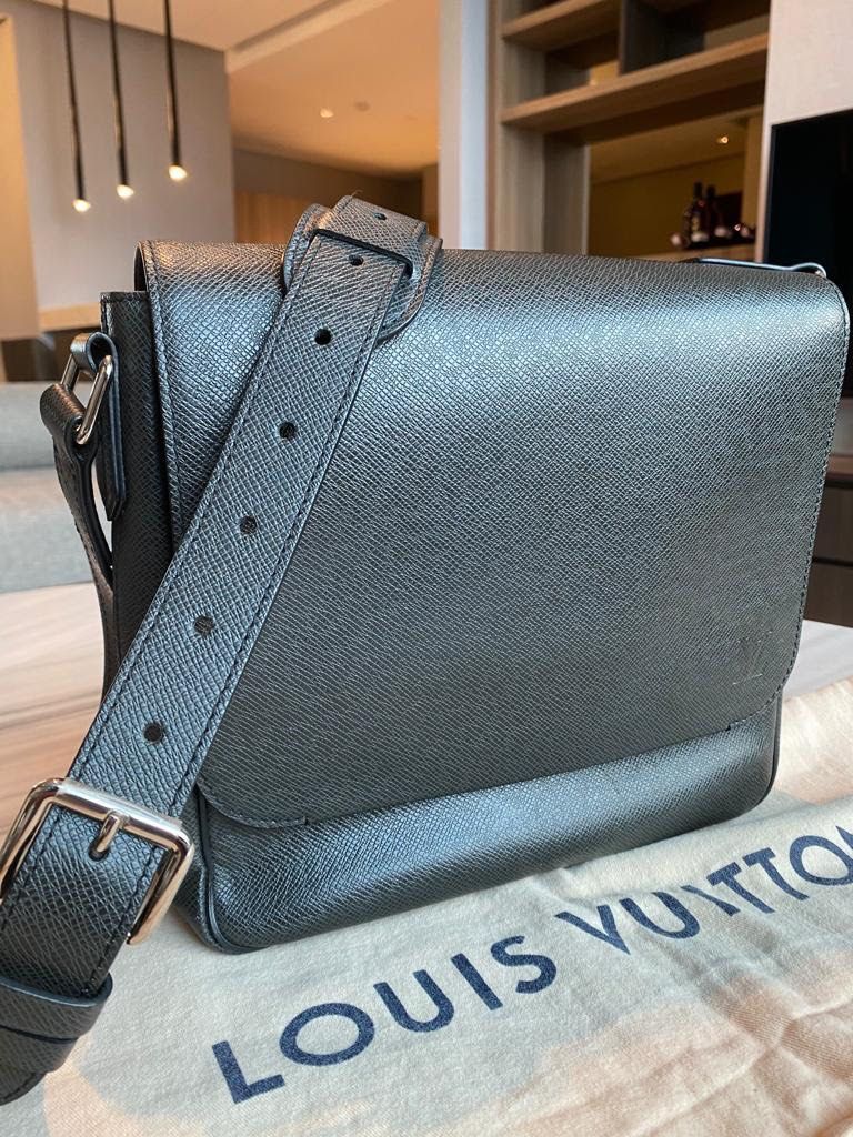 LV Louis Vuitton (Category: Luxury Bags & Wallets) located in Taguig. Submitted by dianek01 (Listing ID 1398180979, Image 2). Description: Authentic LV ROMAN PM TAIGA Leather 100% money back guarantee With original dustbag and receipt in very good condition 26 x 25 x 6.5 cm ( length x height x width ) - Taiga cowhide leather - Textile lining - Cowhide leather trim - Silver colored metallic pieces - Zip closure - Adjustable and non-removable leath