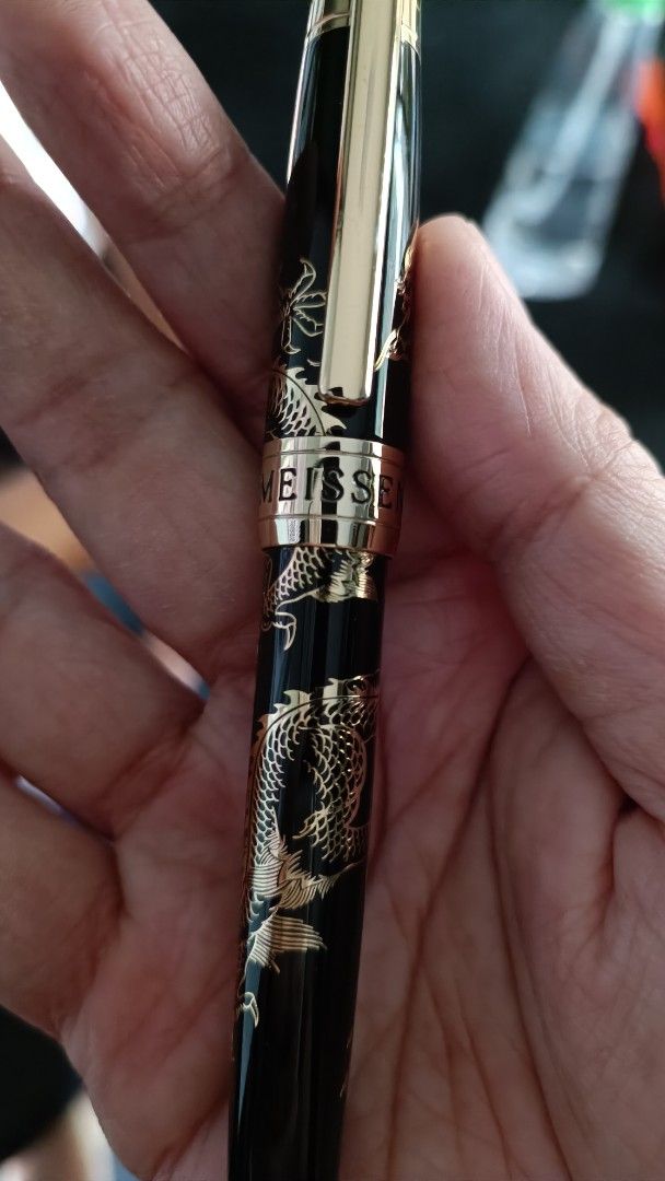 Meissen Dragon Design Pen (Category: Luxury Accessories) located in Cavite. Submitted by premfinds (Listing ID 1398226623, Image 3). Description: - Meissen pen with dragon design - Black body with gold accents - Intricate dragon engravings - Comes in a gold presentation box - Unique cap design - Stylish writing instrument.