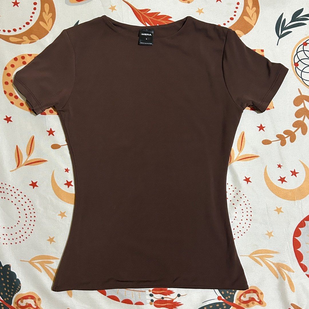 Mera Renata Premium Tops (Category: Shirts) located in Imus. Submitted by ofsunflowers_ (Listing ID 1398262121, Image 2). Description: Mera Renata Premium Tops - Sold as bundle only (original price - ₱264.16 each) - Double lined, Short sleeve, and slim fitting - Colors: Choco Brown, Black, White - Small size - All are in good condition. White may have visible stains (washable). Can send other pics as requested. MOP: BPI or Gcash MOD: J&T / LBC / 