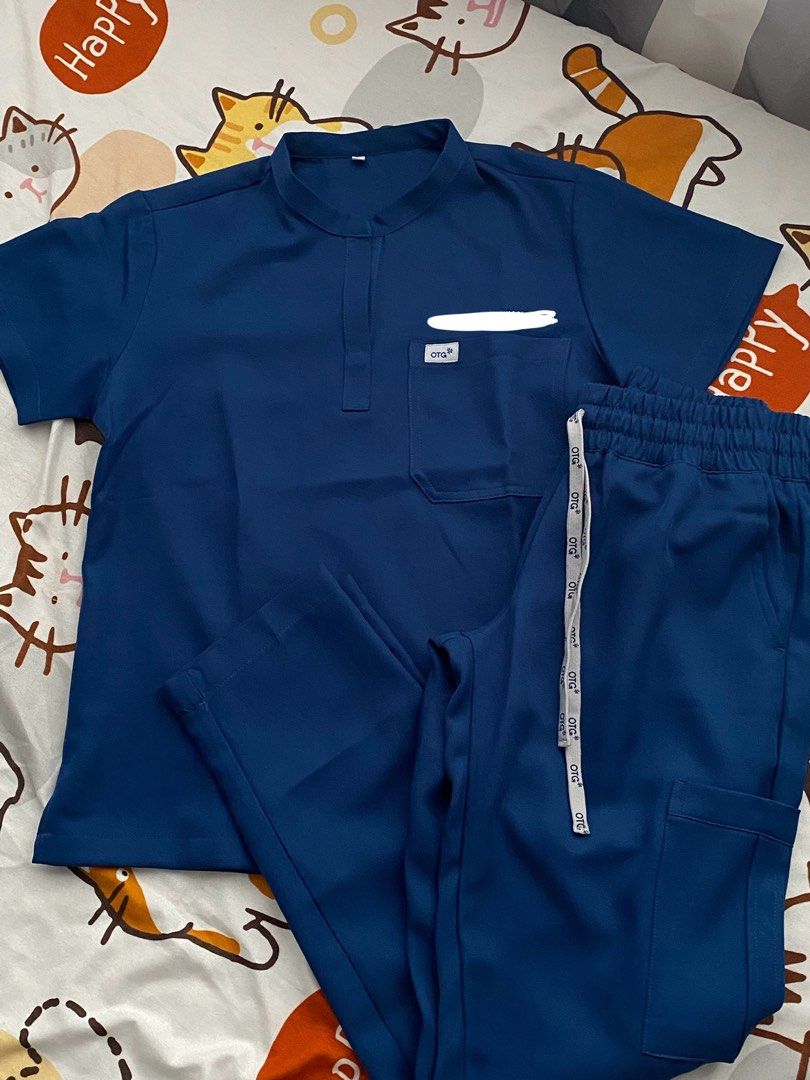 OTG SCRUBS (Category: Activewear) located in Quezon City. Submitted by dan.bam (Listing ID 1398177549, Image 2). Description: OTG SCRUBS - twill fabric Mandarin collar Used once only!! Bought this for 1.7k Rfs: not really my style Has embroidery! Otg staff said they remove embroidery names for only 100 php LOCATION: QC can do same day delivery via lalamove & regular shipping through j&t .