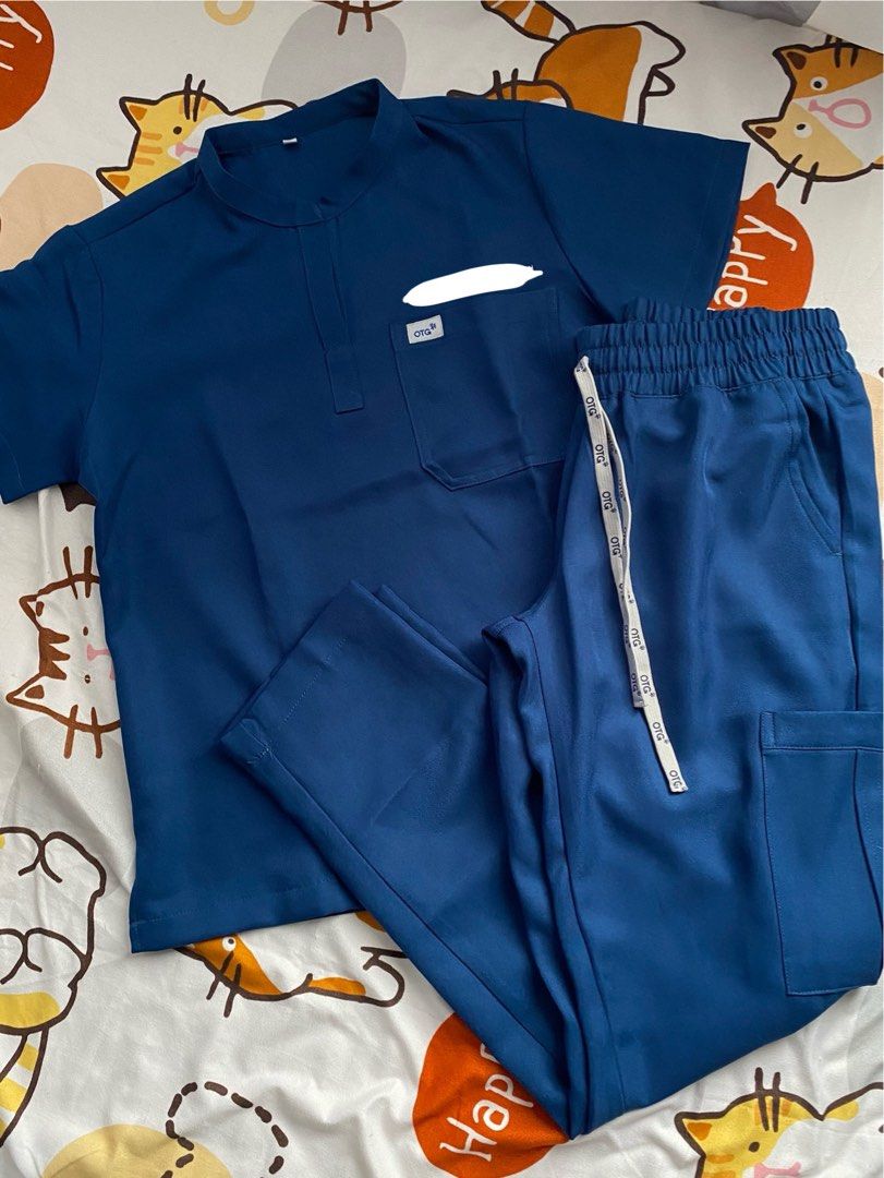 OTG SCRUBS (Category: Activewear) located in Quezon City. Submitted by dan.bam (Listing ID 1398177549, Image 1). Description: OTG SCRUBS - twill fabric Mandarin collar Used once only!! Bought this for 1.7k Rfs: not really my style Has embroidery! Otg staff said they remove embroidery names for only 100 php LOCATION: QC can do same day delivery via lalamove & regular shipping through j&t .