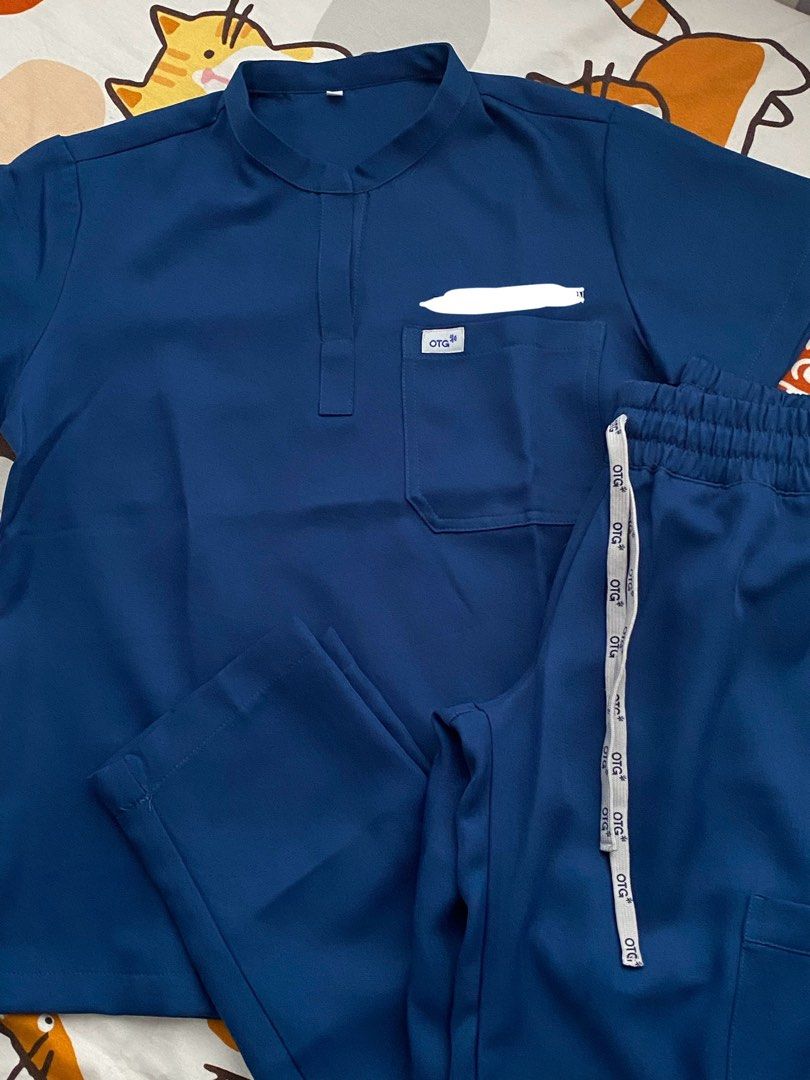 OTG SCRUBS (Category: Activewear) located in Quezon City. Submitted by dan.bam (Listing ID 1398177549, Image 3). Description: OTG SCRUBS - twill fabric Mandarin collar Used once only!! Bought this for 1.7k Rfs: not really my style Has embroidery! Otg staff said they remove embroidery names for only 100 php LOCATION: QC can do same day delivery via lalamove & regular shipping through j&t .