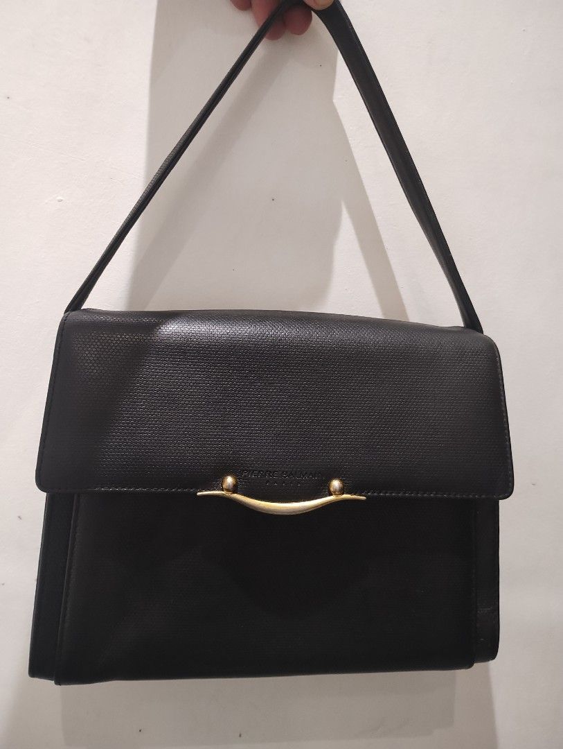 Pierre Balmain Black Handbag (Category: Luxury Bags & Wallets) located in Quezon City. Submitted by martin.0308 (Listing ID 1398311061, Image 1). Description: - Pierre Balmain handbag -Rare Authentic - Black color - Textured exterior - Gold-tone clasp - Long strap included - Spacious interior - Rectangular shape - Classic design.