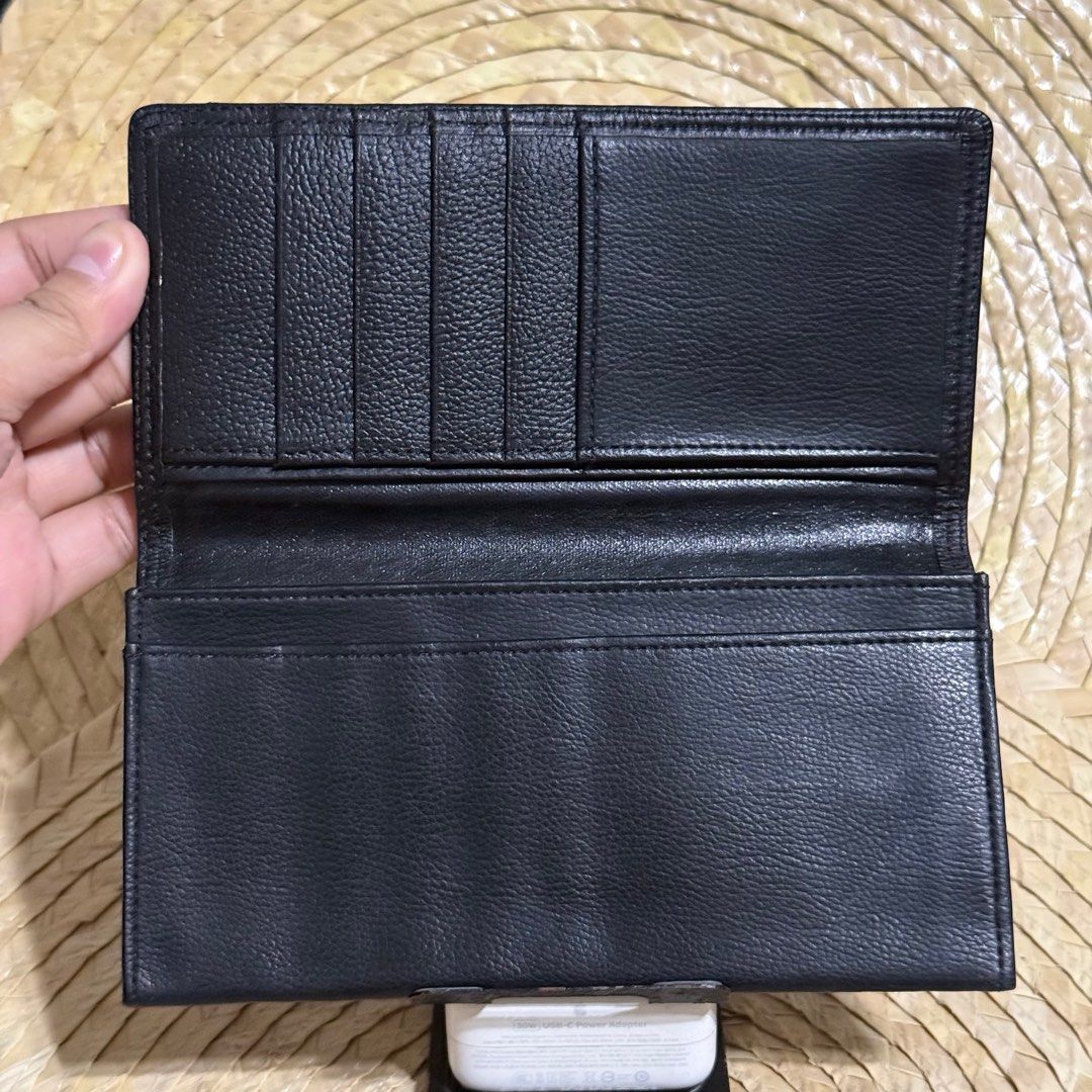 Renoma Paris Black Leather Wallet (Category: Wallets & Card holders) located in Baliuag. Submitted by lifewithkleng (Listing ID 1398340925, Image 2). Description: - Brand: Renoma - Color: Black - Material: Genuine Leather - Features: Multiple card slots, bill compartments, snap closure - Exterior: Textured - Interior: Black lining - Details: Renoma Paris logo visible Pwede sa maarte pwede panregalo.