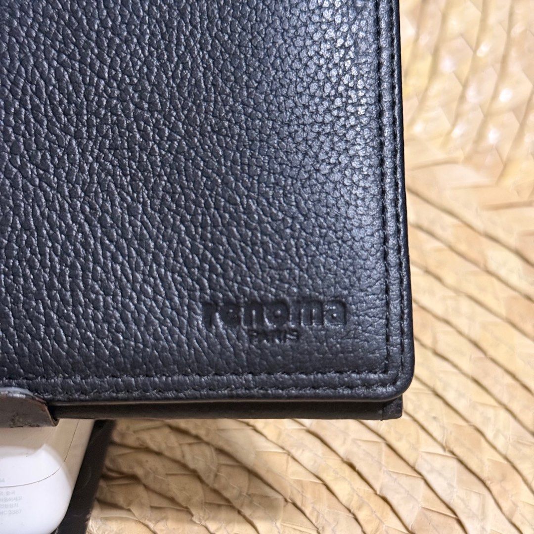 Renoma Paris Black Leather Wallet (Category: Wallets & Card holders) located in Baliuag. Submitted by lifewithkleng (Listing ID 1398340925, Image 3). Description: - Brand: Renoma - Color: Black - Material: Genuine Leather - Features: Multiple card slots, bill compartments, snap closure - Exterior: Textured - Interior: Black lining - Details: Renoma Paris logo visible Pwede sa maarte pwede panregalo.