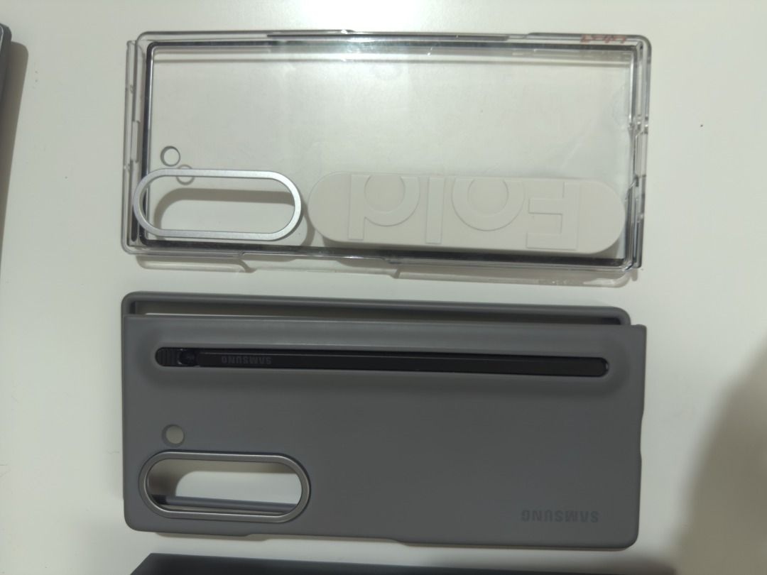 Samsung Fold 6 Like new (Category: Cases & Sleeves) located in Taguig. Submitted by nicegadgetsforsale (Listing ID 1398335871, Image 2). Description: - Samsung Fold 6 (as seen in the images) - Purchased for 120k - Includes cases - Excellent condition and seldom being use (phone for traveling abroad only) - Silver color, Modern and sleek design - 256 Gb - Original Samsung Cases 2 worth 3k and 5k - Open line bought directly from Samsung - Slightly 