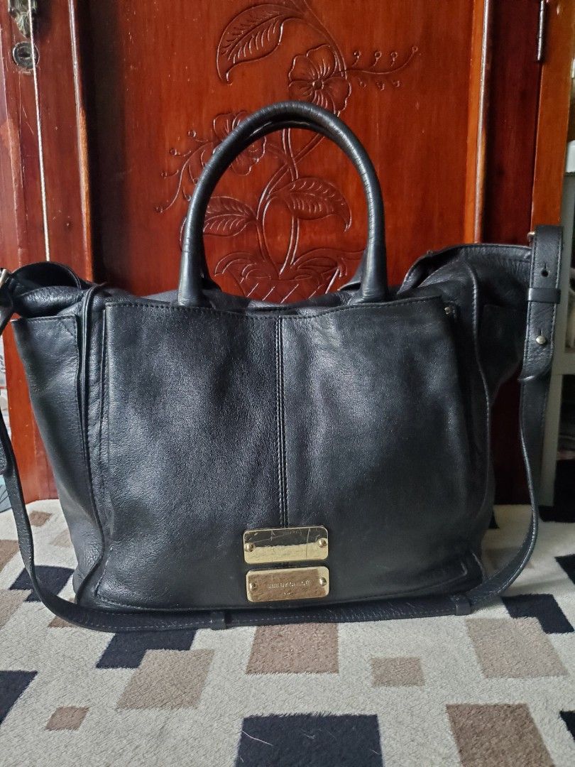 See by Chloé Black Leather two way bag (Category: Luxury Bags & Wallets) located in Manila. Submitted by smicolen (Listing ID 1398210932, Image 1). Description: - See by Chloé black leather handbag - Dual top handles - Detachable shoulder strap - Gold-tone hardware with brand logo - Zipper closure - Signs of wear on handles and hardware - 'SBC' marked zipper pull - pure leather DIMENSIONS: L - 11 W- 11 1/2 Bottom- 7 1/2 sides- 7 .