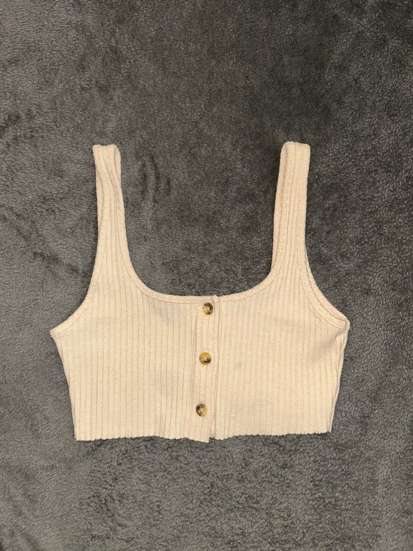 Topshop Ribbed Crop Top (Category: Shirts) located in Binan City. Submitted by mid.elle (Listing ID 1398215814, Image 1). Description: - Topshop cream crop top - Ribbed texture - Button-up front - Wide straps - UK size 4 / US size 2 -See when worn photo .