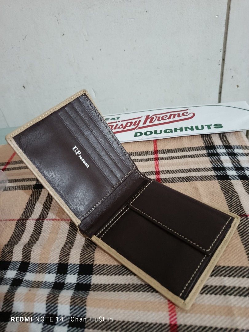 U.P. Renoma Wallet (Category: Luxury Bags & Wallets) located in Calamba. Submitted by chanmagpantay (Listing ID 1398217911, Image 3). Description: - U.P. Renoma wallet - Exterior: Beige - Interior: Brown - Multiple card slots - Bill compartment - Compact size - Leather material ‼️For Sale‼️ 💥UP Renoma Wallet💥 Excellent Condition P650💸 Location: Calamba Laguna Courier: J&T - Brand name visible.