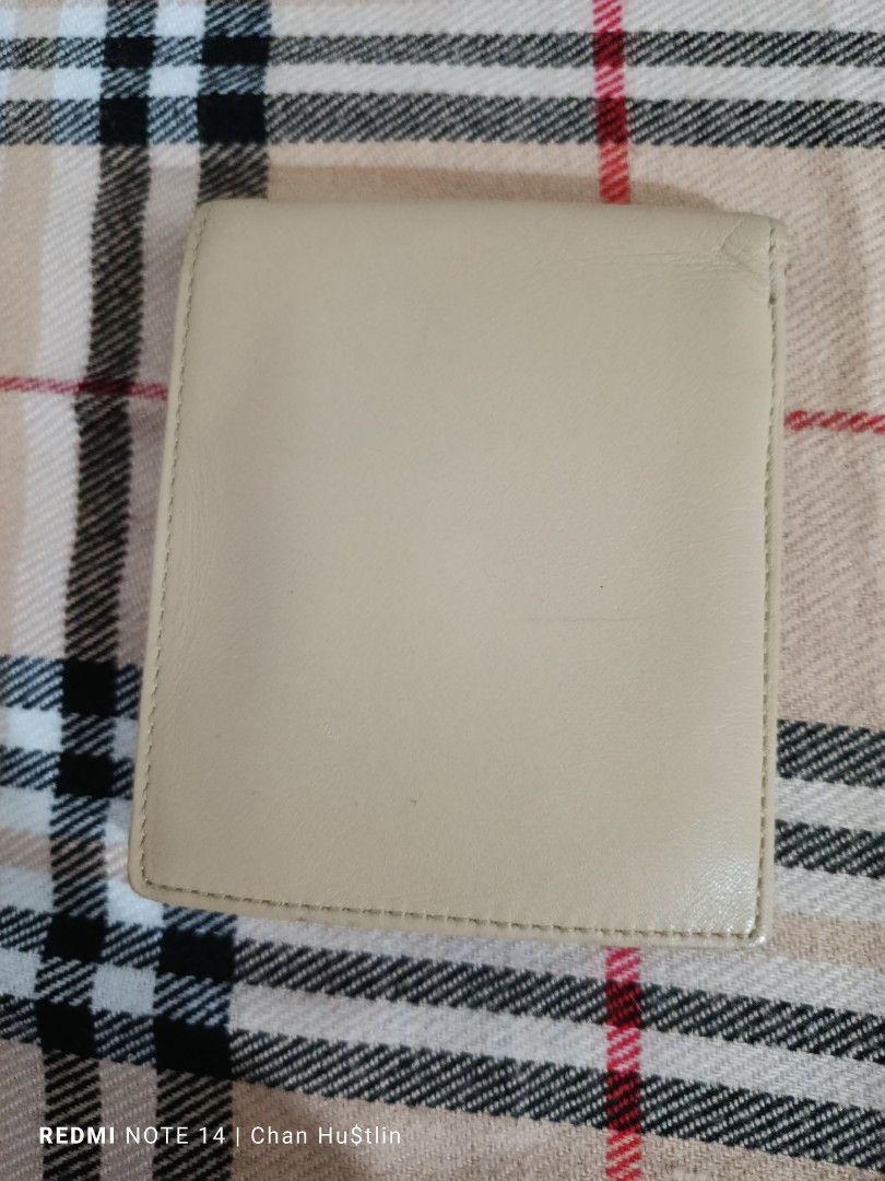U.P. Renoma Wallet (Category: Luxury Bags & Wallets) located in Calamba. Submitted by chanmagpantay (Listing ID 1398217911, Image 2). Description: - U.P. Renoma wallet - Exterior: Beige - Interior: Brown - Multiple card slots - Bill compartment - Compact size - Leather material ‼️For Sale‼️ 💥UP Renoma Wallet💥 Excellent Condition P650💸 Location: Calamba Laguna Courier: J&T - Brand name visible.