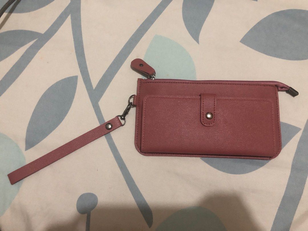 Wallet with Wrist Strap (Category: Wallets & Card holders) located in Bacoor. Submitted by declutteredbygem (Listing ID 1398278944, Image 1). Description: - Nude Pink wallet - Multiple card slots - Zippered compartment - Includes wrist strap - Snap closure - Simple, everyday design.