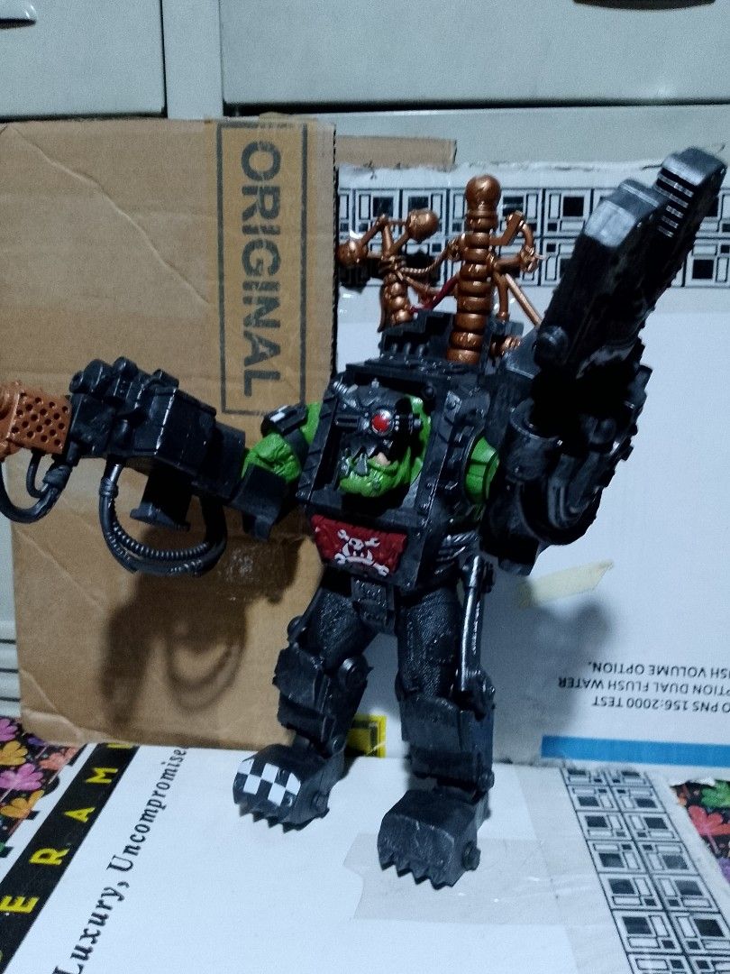 Warhammer 40k Ork Meganob Action Figure (Category: Action & Battle Toys) located in Taguig. Submitted by titus40k (Listing ID 1398290666, Image 3). Description: - Ork Meganob warhammer action figure by mcfarlane. - Detailed armor and mechanical attachments - Green head with red eye - Skull emblem on chest - Equipped with a large gun - Includes a mechanical claw pick up only thru grab/lalamove.