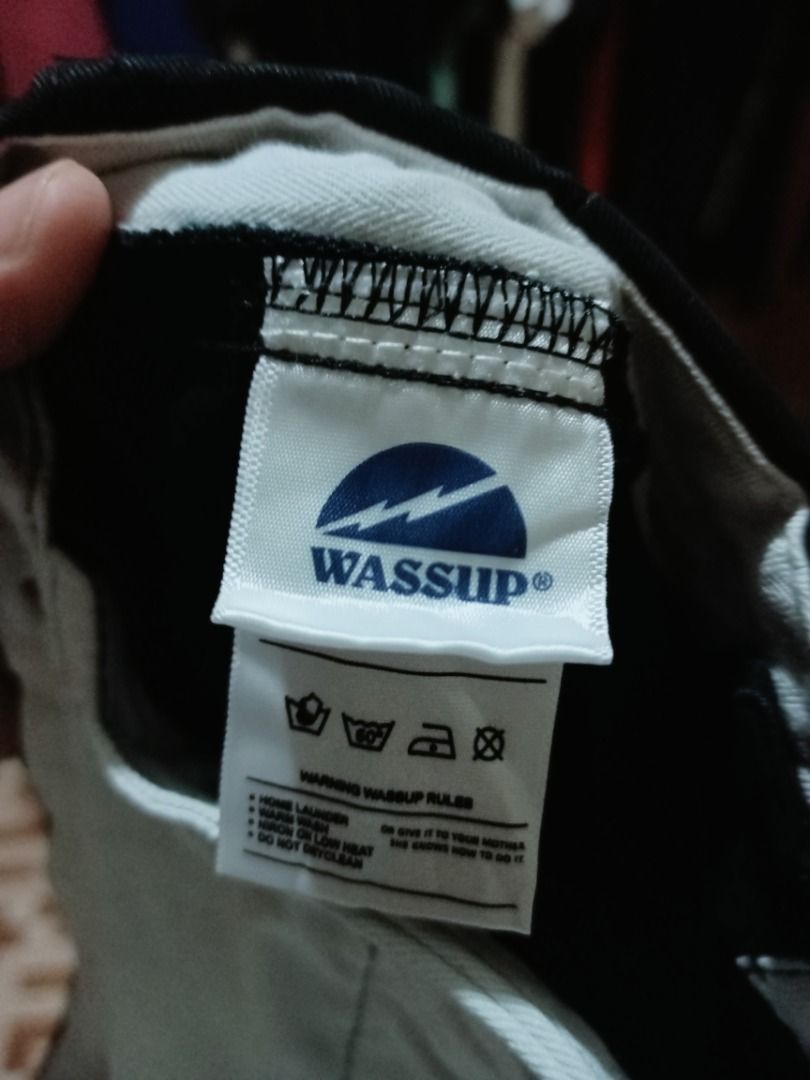Wassup Black Pants (Category: Jeans) located in Arayat. Submitted by drip_curated070288 (Listing ID 1398191750, Image 3). Description: Black Wassup pants. Features the "Freesoul wsp" logo on the back pocket. The pants have a blue Wassup tag. The care instructions are also visible. The pants have a white lining..
