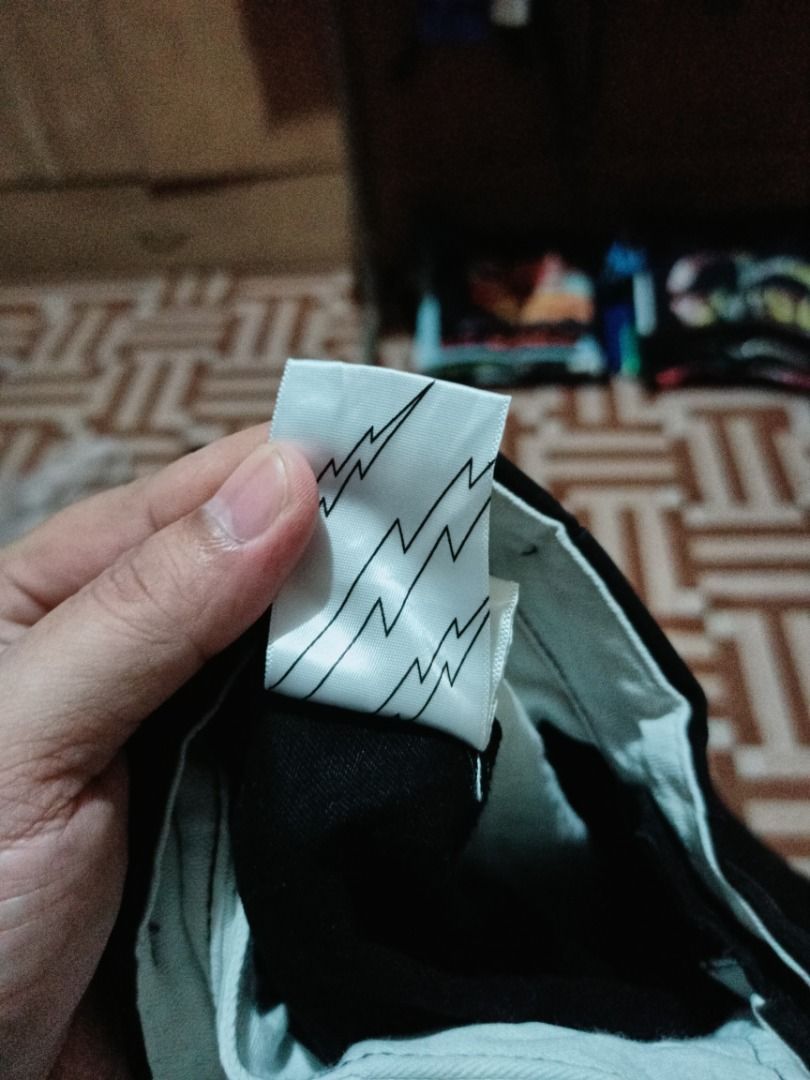 Wassup Black Pants (Category: Jeans) located in Arayat. Submitted by drip_curated070288 (Listing ID 1398191750, Image 2). Description: Black Wassup pants. Features the "Freesoul wsp" logo on the back pocket. The pants have a blue Wassup tag. The care instructions are also visible. The pants have a white lining..