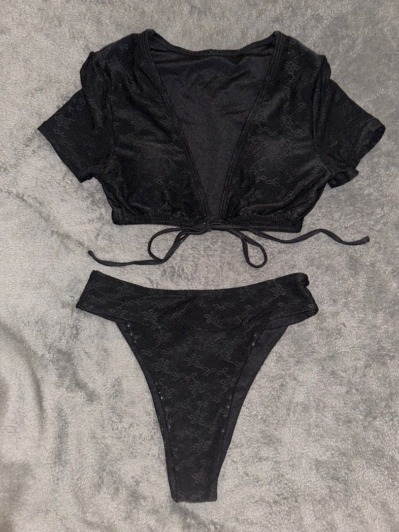 Zaful Black Bikini Set (Category: Bikinis & Swimsuits) located in Binan City. Submitted by mid.elle (Listing ID 1398216573, Image 1). Description: - Zaful black bikini set - Cropped, short-sleeved top with tie closure - High-cut bottoms - Textured, patterned design - Size Small -Used only once .