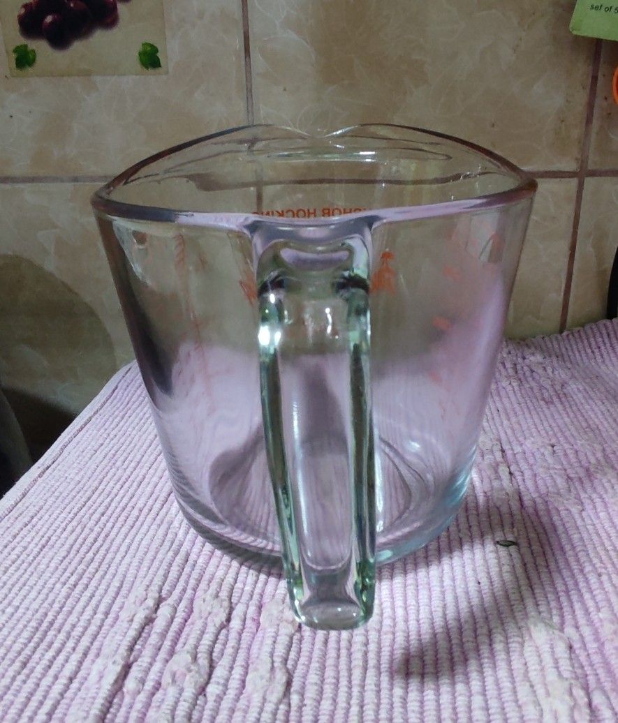 Anchor Hocking Fire-King Measuring Cup (Category: Bakeware) located in Las Pinas. Submitted by lawki_stuff (Listing ID 1398523485, Image 3). Description: - Anchor Hocking Fire-King measuring cup - Clear glass with red measurement markings - Features both ounces and milliliters - Includes a handle and pouring spout - Capacity: 32 oz (946 ml) / 1000ml - Microwave safe - Ideal for baking and cooking - No issue& no cracks - Good as new..
