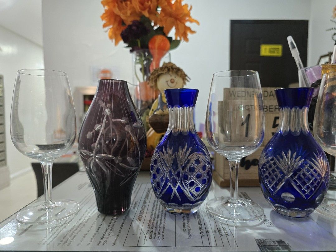 Blue Crystal Vase (Category: Vases & Decorative Bowls) located in Taguig. Submitted by threadsntable (Listing ID 1398484576, Image 1). Description: This beautiful blue crystal vase features an intricate Bohemian cut-glass design, paired with three matching wine glasses that sparkle in any light..