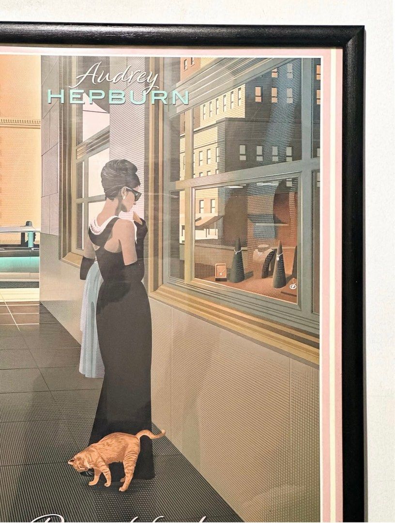 Breakfast at Tiffany's Audrey Hepburn Large Frame (Category: Storybooks) located in Manila. Submitted by mwandco (Listing ID 1398449732, Image 2). Description: - Framed poster featuring Audrey Hepburn from 'Breakfast at Tiffany's'. - Iconic scene of Hepburn in a black dress. - Includes movie title and cast names. - Framed in a black frame with a pink border. - Size: 14 × 20”.