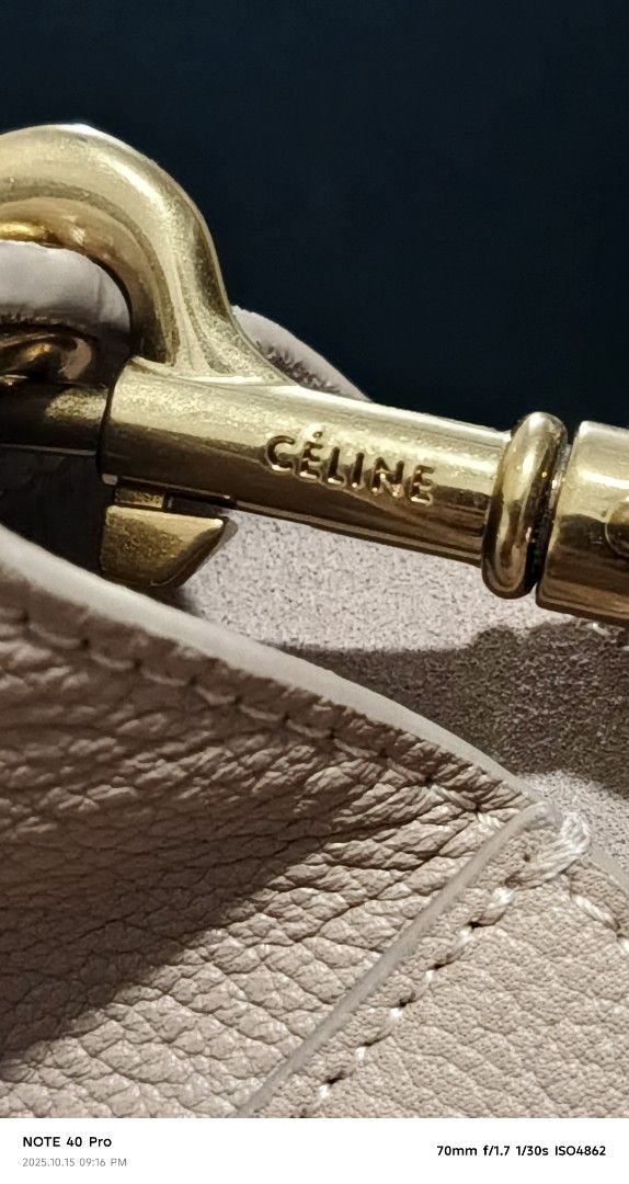 Celine Hobo Bag (Category: Luxury Bags & Wallets) located in Manila. Submitted by jeffies4ti96921 (Listing ID 1398497664, Image 3). Description: - Authentic Celine hobo bag - Neutral color - Shoulder strap - Zipper closure with Celine branding - Made in Italy - Leather exterior - Fabric strap.