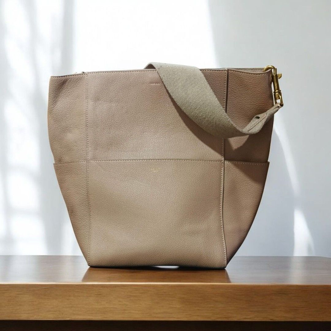 Celine Hobo Bag (Category: Luxury Bags & Wallets) located in Manila. Submitted by jeffies4ti96921 (Listing ID 1398497664, Image 1). Description: - Authentic Celine hobo bag - Neutral color - Shoulder strap - Zipper closure with Celine branding - Made in Italy - Leather exterior - Fabric strap.