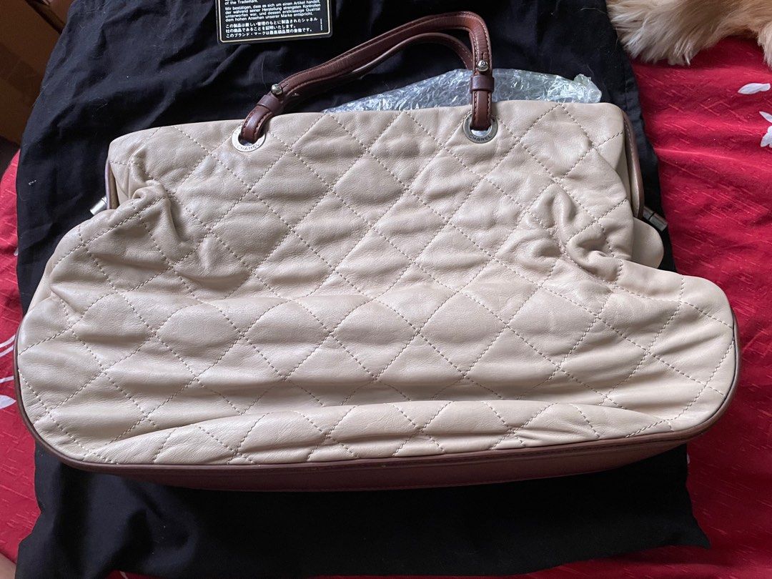 Chanel Quilted Leather Handbag (Category: Luxury Bags & Wallets) located in Quezon City. Submitted by decluttertherapymnl (Listing ID 1398464579, Image 2). Description: - Authentic Chanel handbag - Features quilted design with CC logo - Includes chain strap and leather handles - Interior has a zip pocket - Comes with dust bag and authenticity card - Made in Italy.
