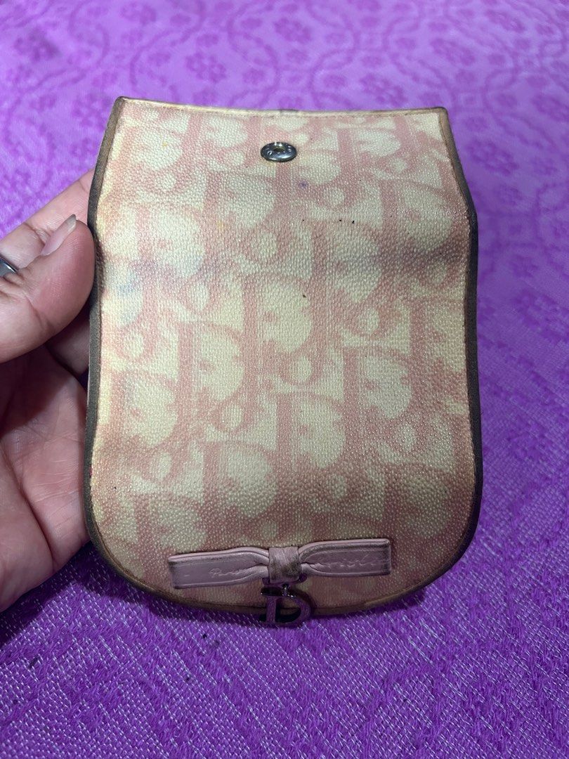 Christian Dior Key Holder (Category: Luxury Bags & Wallets) located in Quezon City. Submitted by kayesantos7 (Listing ID 1398392571, Image 3). Description: - Authentic Christian Dior key holder - Features the iconic pink and beige Dior Oblique pattern - Adorned with a bow detail and 'D' charm - Interior crafted from pink leather - Includes key hooks Selling my Christian Dior trotter pink keycase. In good preloved condition. Has signs of usage alr