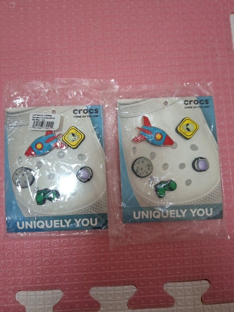 Crocs Jibbitz Space Theme Charms (Category: Slippers and slides) located in Manila. Submitted by shenshaun (Listing ID 1398398339, Image 1). Description: - 500 each , Noveleta Cavite - Space-themed Crocs Jibbitz charms. - Includes: alien, rocket, planet, and dinosaur charms. - All charms are new. - Comes in original packaging. - Great for personalizing your Crocs. - Two sets available..