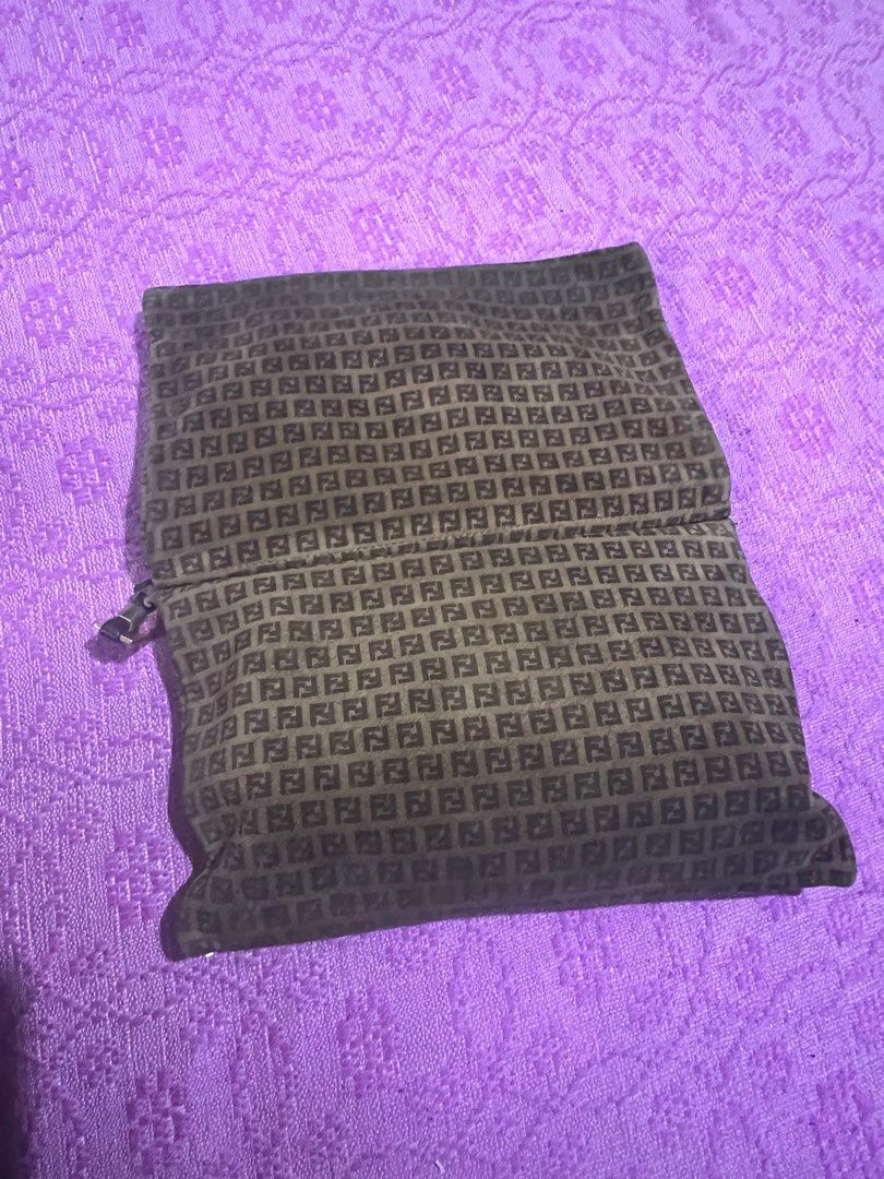 Fendi Clutch Bag (Category: Luxury Bags & Wallets) located in Quezon City. Submitted by kayesantos7 (Listing ID 1398379857, Image 1). Description: - Super Sale!!!! Authentic Fendi clutch bag - Features the iconic FF logo pattern - Leather interior - Gold-tone metal clasp - Zipper with logo charm - Made in Italy - Serial number: 77226 Selling my vintage Fendi clutch/wallet. Buttery-soft material. Gold tone clasp has already faded. Such a nice coll