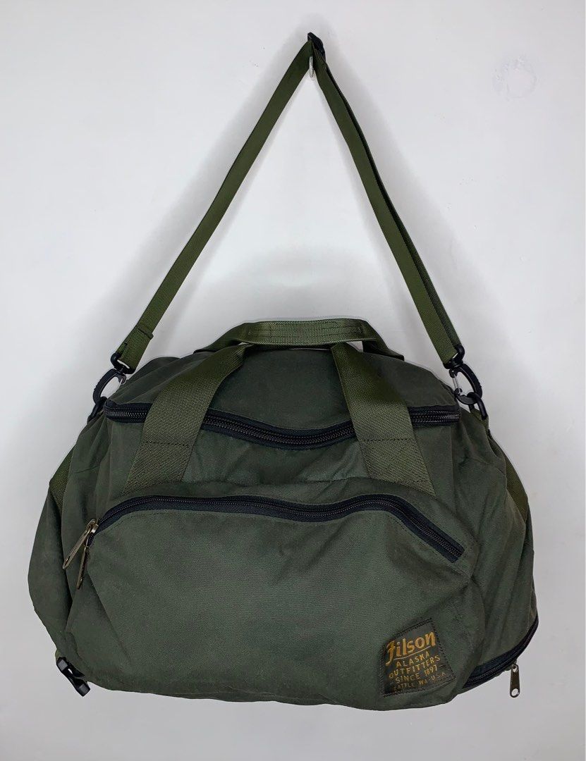 Filson Ballistic Duffle Bag (Category: Backpacks) located in Binan City. Submitted by disqualified_but_undefeated (Listing ID 1398382594, Image 1). Description: Filson Ballistic Duffle Bag 3 way Bag Color- Otter Green Unisex The Duffle Backpack from Filson pulls double-duty as a duffle or a backpack for hands-free carry dockside, in the field, or on the tarmac. It’s built with hardwearing 600D nylon for the ideal weight and rugged durability, and