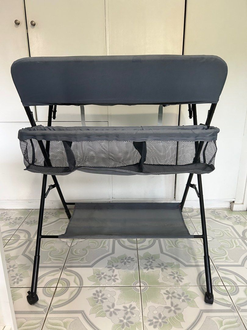 Foldable Baby Changing Table with Giraffe Design (Category: Changing Mats & Accessories) located in San Pedro. Submitted by ukaynikukay (Listing ID 1398412789, Image 2). Description: - Built-in measuring guide - Includes safety strap - Storage basket for essentials - Lower shelf for extra storage - Sturdy, foldable frame - Wheels for easy movement and locks - Collapsible for easy storage - Up to 15kg capacity.