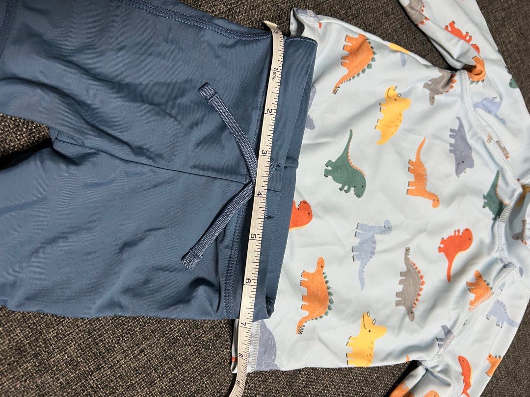 H&M Dinosaur Swimsuit Set 2-6M (Category: Babies & Kids Fashion) located in Makati City. Submitted by all.things.loved (Listing ID 1398405256, Image 1). Description: - H&M baby swimsuit set, perfect for ages 2-6 months. - Features a light blue rash guard with a fun dinosaur print. - Includes matching blue swim shorts. - Rash guard has long sleeves for added sun protection. .