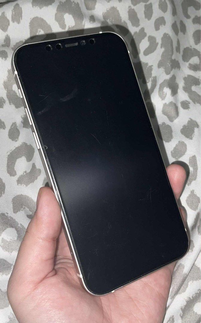 iPhone 12 - 256 GB in White (Category: iPhone 12 Series) located in Las Pinas. Submitted by handmedown143 (Listing ID 1398399210, Image 3). Description: * The scratches on the screen is only on the screen protector * Negotiable * Original Price: 38,000 INCLUSION: * Phone Charger (not originally iPhone charger) .