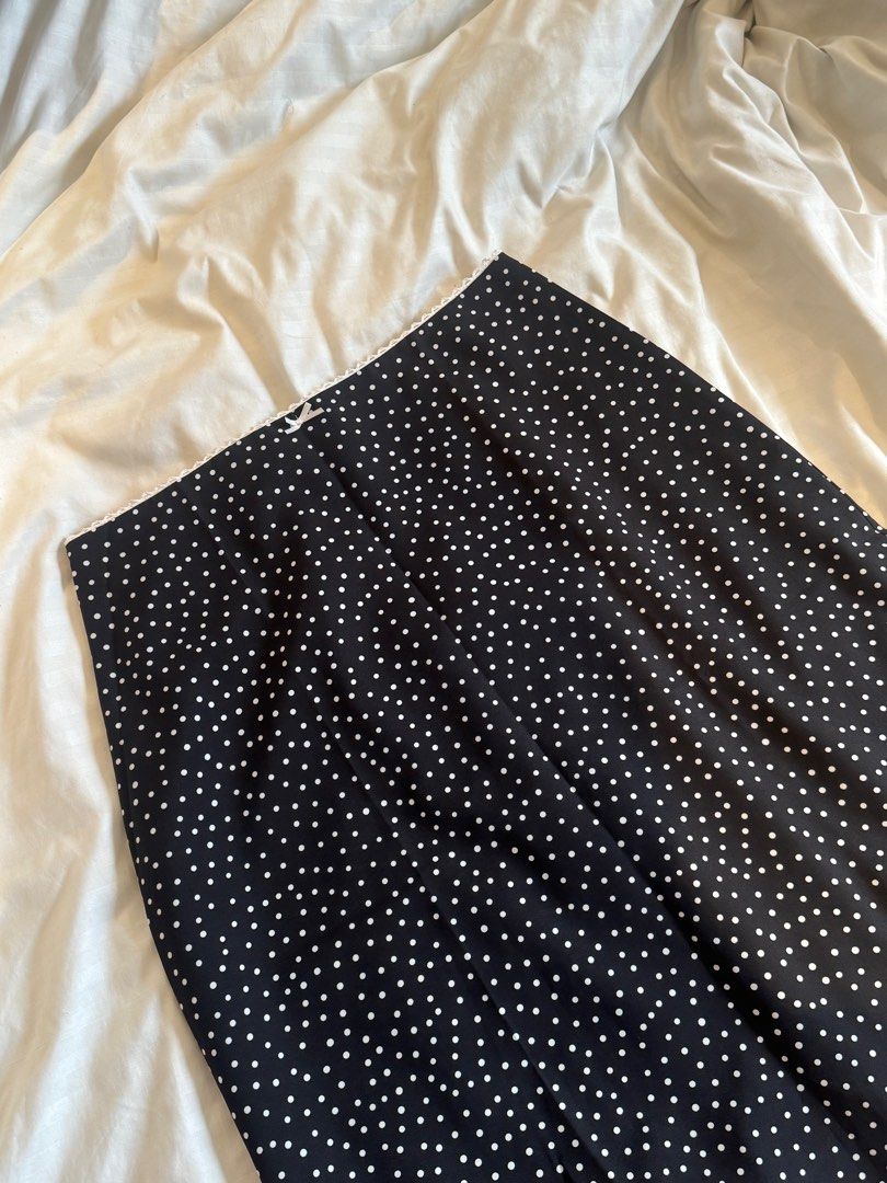 Just Because Studio Amalfi Polka Dot Skirt (Category: Skirts) located in San Fernando. Submitted by _kindaky0t (Listing ID 1398420589, Image 2). Description: - Brand: Just Because - Size: Small - Style: Midi skirt - Features: Black with white polka dots, white lace trim at the waist - Material: Lightweight fabric - Design: Classic and versatile - Used once to try on - ‼️SKIRT ONLY‼️.