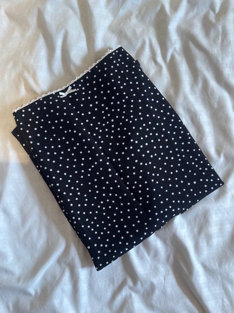 Just Because Studio Amalfi Polka Dot Skirt (Category: Skirts) located in San Fernando. Submitted by _kindaky0t (Listing ID 1398420589, Image 3). Description: - Brand: Just Because - Size: Small - Style: Midi skirt - Features: Black with white polka dots, white lace trim at the waist - Material: Lightweight fabric - Design: Classic and versatile - Used once to try on - ‼️SKIRT ONLY‼️.