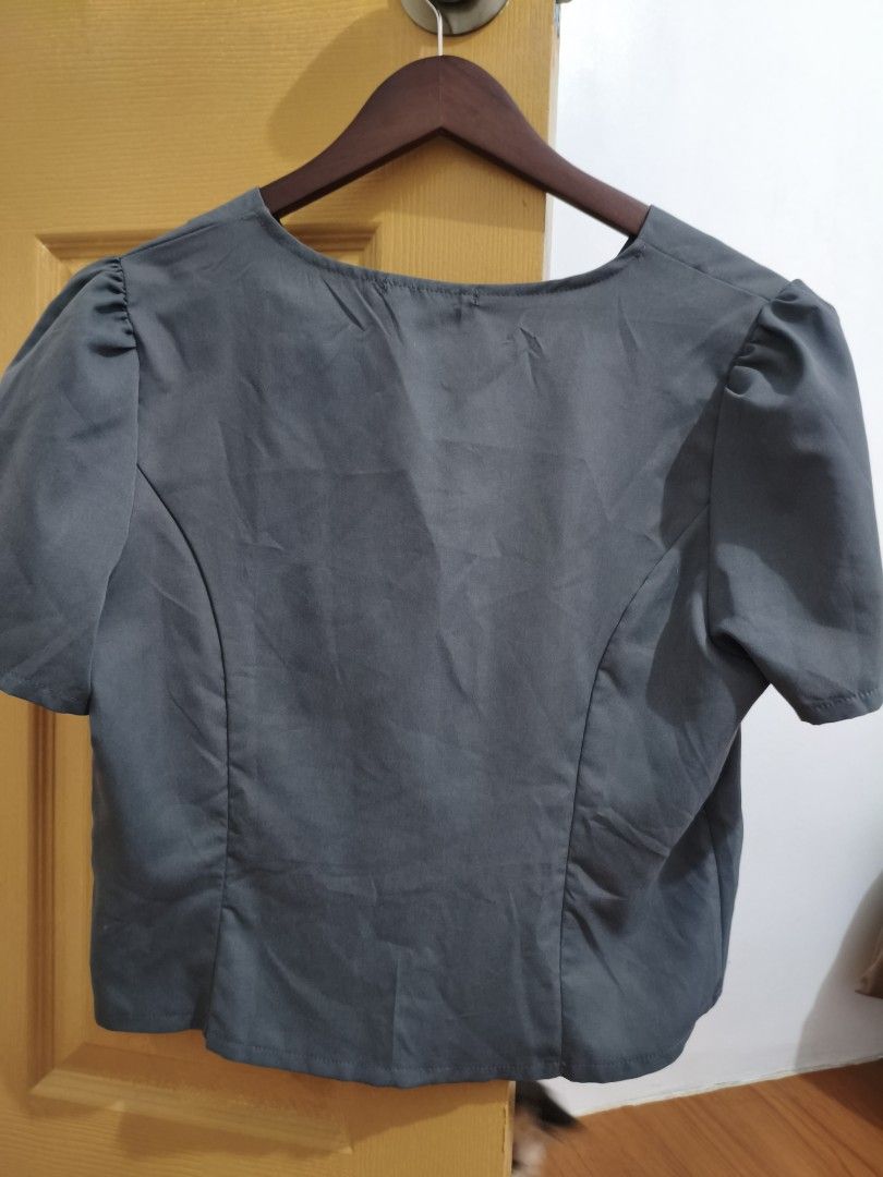 Lovito Gray Top and Pants Set (Category: Sets or Coordinates) located in General Trias. Submitted by pepperbits (Listing ID 1398368853, Image 3). Description: - Lovito gray top and pants set. - Top: short sleeves, V-neck, button closure. - Pants: elastic waistband. - Gray color. - Size tag visible on top. - Versatile set..