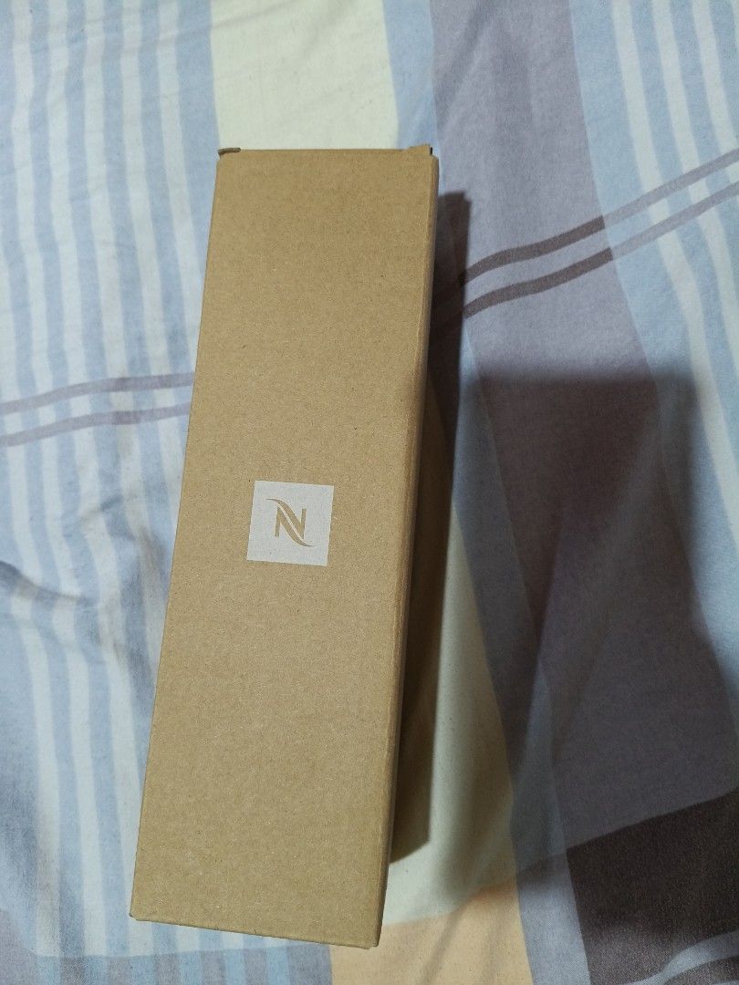 Nespresso Water Bottle with Silicone Sleeve (Category: Water Bottles & Tumblers) located in Quezon City. Submitted by mhiemime (Listing ID 1398451798, Image 3). Description: - Nespresso water bottle - Bamboo lid - Orange silicone sleeve - 500 ml / 17.60 fl oz capacity - Includes original box - Includes Nespresso information card ALL SALES AFTER THE DEALS ARE FINAL (NO RETURN NO REFUND).