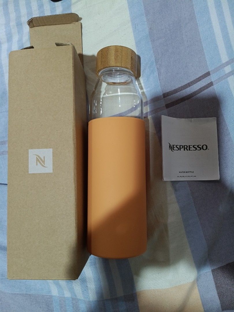 Nespresso Water Bottle with Silicone Sleeve (Category: Water Bottles & Tumblers) located in Quezon City. Submitted by mhiemime (Listing ID 1398451798, Image 1). Description: - Nespresso water bottle - Bamboo lid - Orange silicone sleeve - 500 ml / 17.60 fl oz capacity - Includes original box - Includes Nespresso information card ALL SALES AFTER THE DEALS ARE FINAL (NO RETURN NO REFUND).