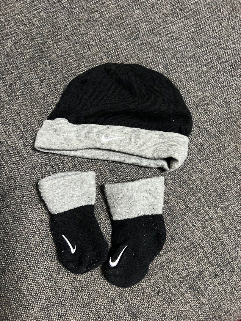 Nike Baby Beanie and Socks Set (Category: Babies & Kids Fashion) located in Makati City. Submitted by all.things.loved (Listing ID 1398405500, Image 1). Description: Giving this as freebie for a buyer - Nike beanie and socks set - Color: Black and gray - Beanie: Gray brim, white Nike logo - Socks: Black with gray cuffs, white Nike logo - Perfect for keeping your little one warm and stylish.