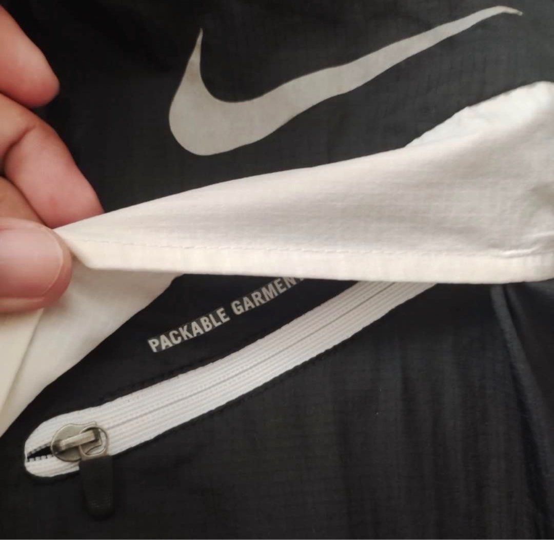 Nike Windbreaker Jacket (Category: Coats, Jackets and Outerwear) located in Cavite. Submitted by jca__ (Listing ID 1398453299, Image 2). Description: - Nike windbreaker jacket - Size: M (fits 165-175cm height) - Features: Hood, zipper, white diagonal stripe - Material: 100% nylon - Made in Vietnam - manipis, goods pamatong.