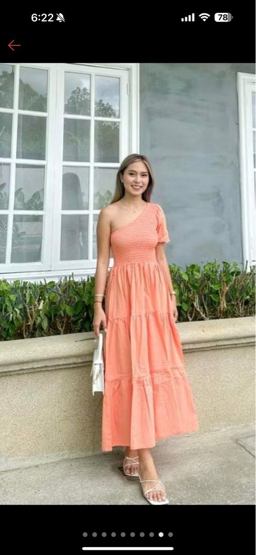 Peach One Shoulder Smocking Maxi Dress (Category: Dresses) located in Mandaluyong City. Submitted by iamjenfr (Listing ID 1398446297, Image 2). Description: - Leilani maxi dress - Peach color - One-shoulder design - Smocking details - Tiered skirt - Lightweight fabric - Maxi length - Suitable for various occasions Used only for a photoshoot. Rfs: decluttering.