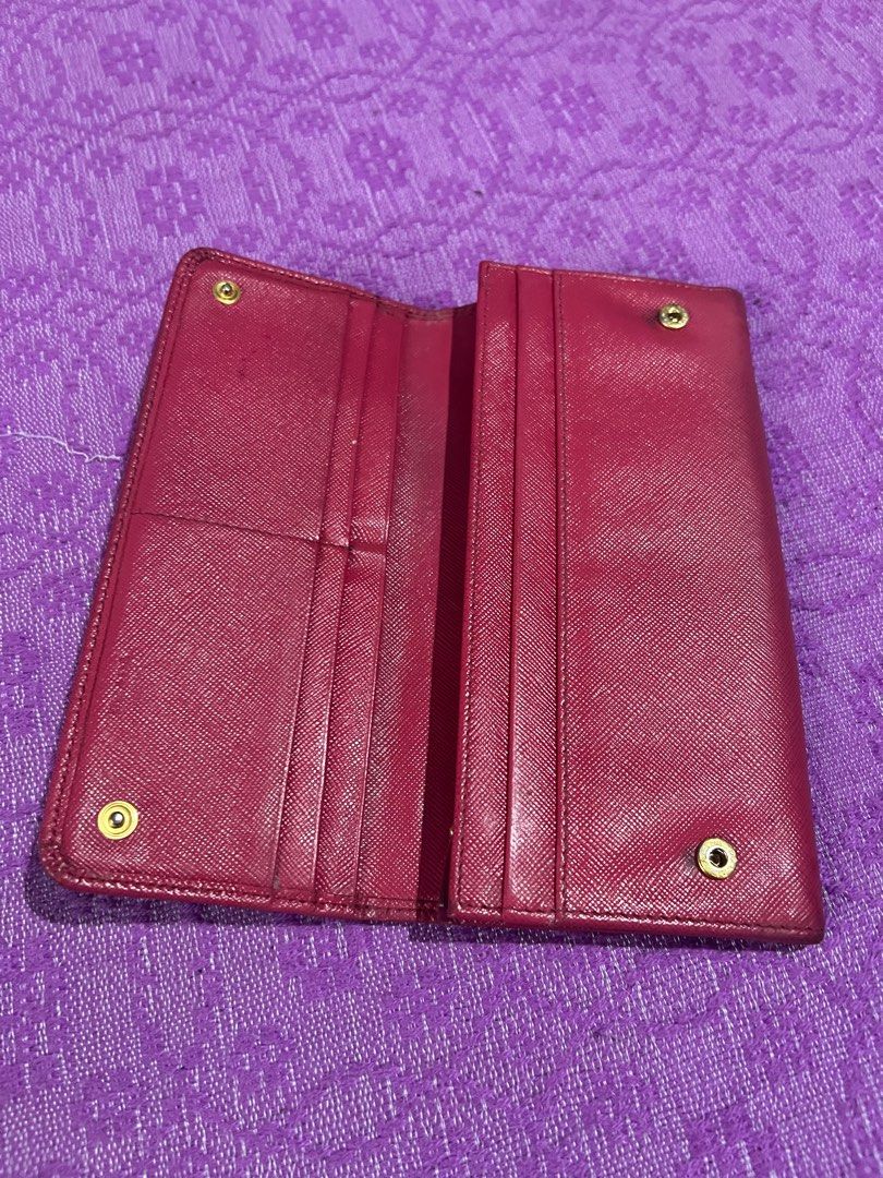 Prada Long Wallet (Category: Luxury Bags & Wallets) located in Quezon City. Submitted by kayesantos7 (Listing ID 1398383274, Image 3). Description: - Authentic Prada long wallet - Beautiful pink color - Multiple card slots and zippered compartment - Snap closure - Includes dust bag - Prada logo visible, very pretty Prada continental long wallet. Has signs of use already. Kindly manage your expectations. All sales are final. No return and no excha