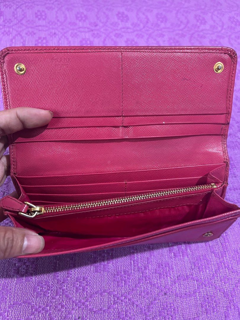 Prada Long Wallet (Category: Luxury Bags & Wallets) located in Quezon City. Submitted by kayesantos7 (Listing ID 1398383274, Image 1). Description: - Authentic Prada long wallet - Beautiful pink color - Multiple card slots and zippered compartment - Snap closure - Includes dust bag - Prada logo visible, very pretty Prada continental long wallet. Has signs of use already. Kindly manage your expectations. All sales are final. No return and no excha