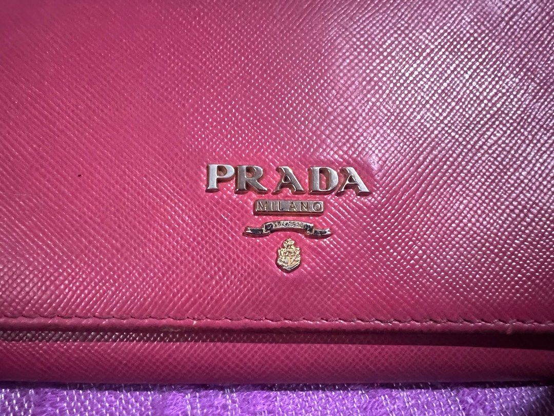 Prada Long Wallet (Category: Luxury Bags & Wallets) located in Quezon City. Submitted by kayesantos7 (Listing ID 1398383274, Image 2). Description: - Authentic Prada long wallet - Beautiful pink color - Multiple card slots and zippered compartment - Snap closure - Includes dust bag - Prada logo visible, very pretty Prada continental long wallet. Has signs of use already. Kindly manage your expectations. All sales are final. No return and no excha