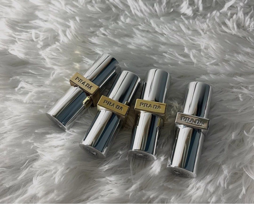 Prada Monochrome Lipstick (Category: Makeup) located in San Pedro. Submitted by hausoflux (Listing ID 1398446125, Image 2). Description: - Prada Monochrome Lipstick available shade: B01, B02, B03, B05, B15, B101, B102, B103, 077, U000 - Elegant silver case with Prada logo - Includes original box - Refillable and rechargeable design - Net weight: 3.5g / 0.13 oz Authentic!! available in minis and full size.